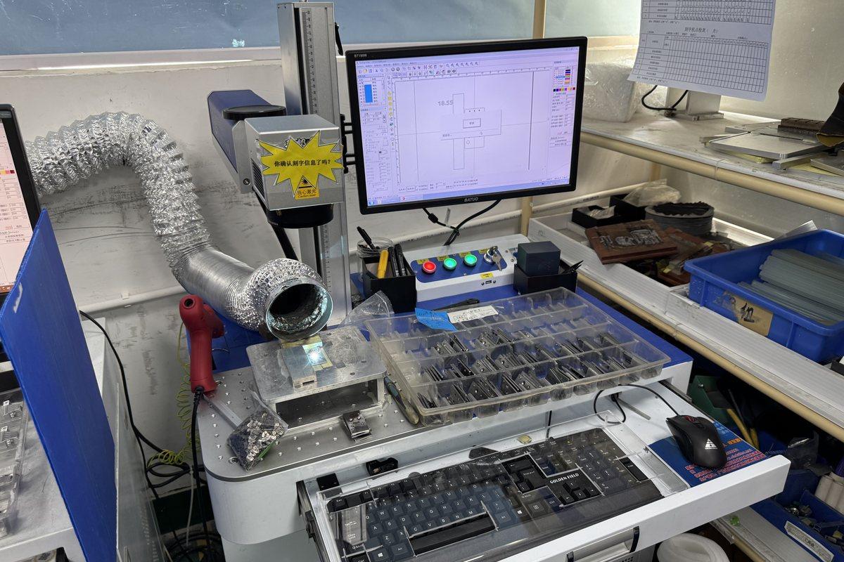 Computer-controlled laser marking station